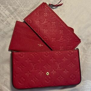 The Félicie Pochette RED is crafted from Monogram Empreinte leather.